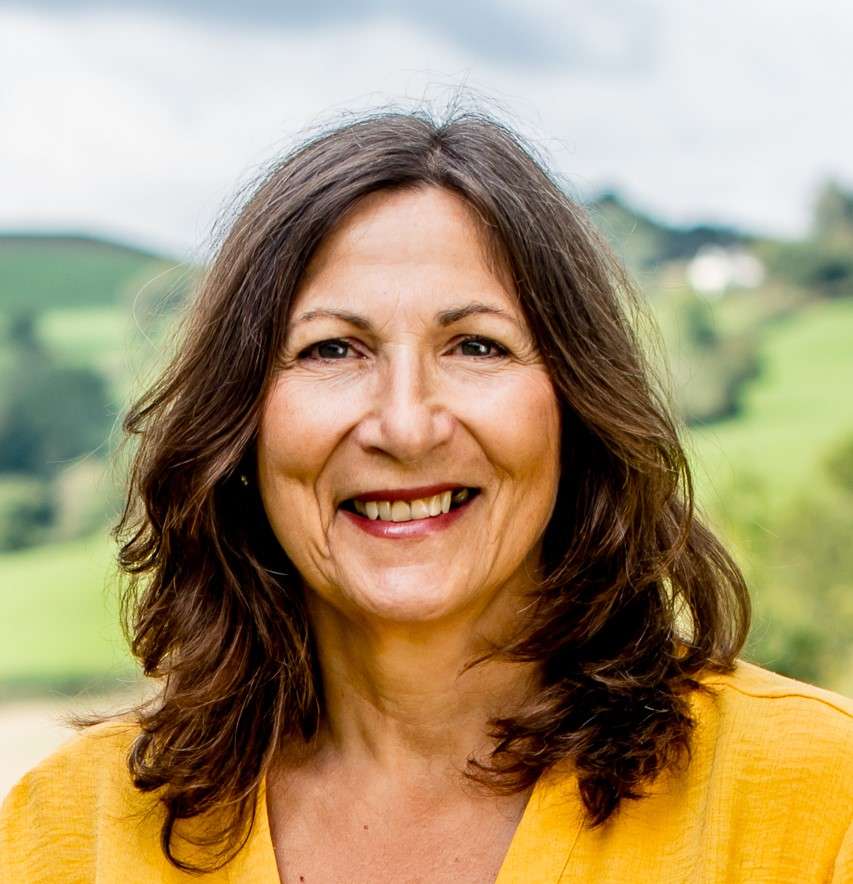 A portrait of Ruth Foster in the countryside